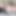 Vinil elbise, çorap ve katırlar giymiş transvestit kendini okşuyor.