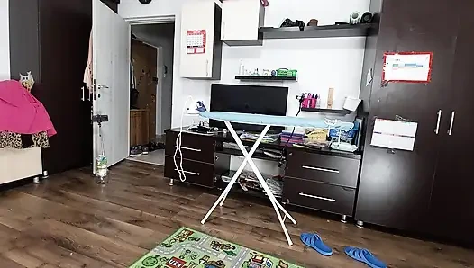 Sexy brunette doing naked chores around the house.