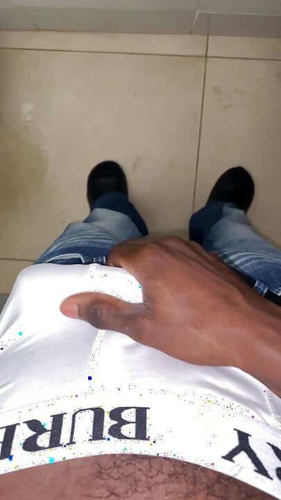 Thug beating his meat in the office