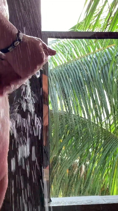 Romantic shower after sex in paradise
