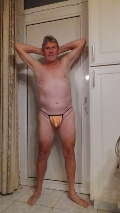 I show myself in a tiny yellow thong.