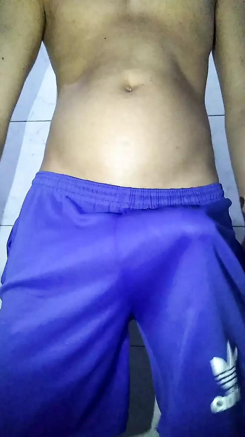 Young boy in shorts playing with his big thick shaved cock very hard horny