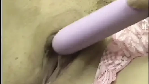 Trampy young brunette Nevaeh Ashton holds vibrator to her clit then shoves it in her shaved cunt