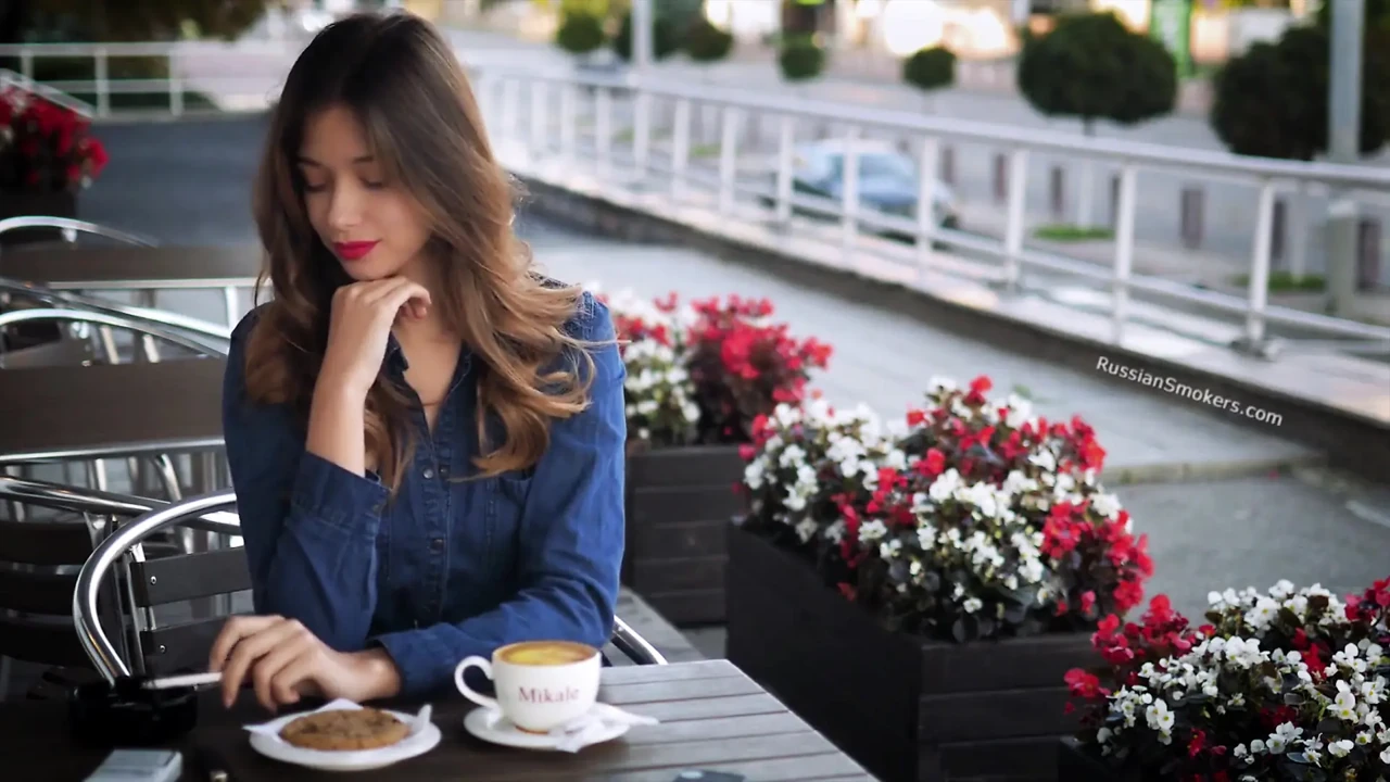 Magnetic Russian Beauty Playing with Cigarette Smoke