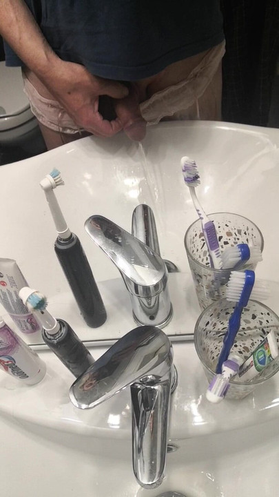 Pissing nicely in the sink...
