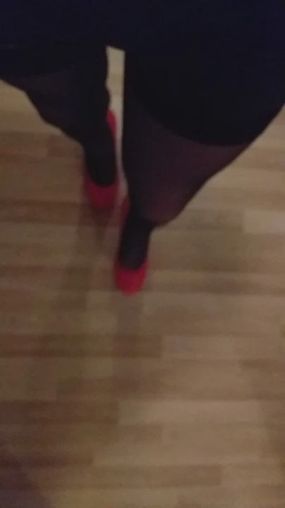 Mystery TS walking in super high heels red shiny stockings