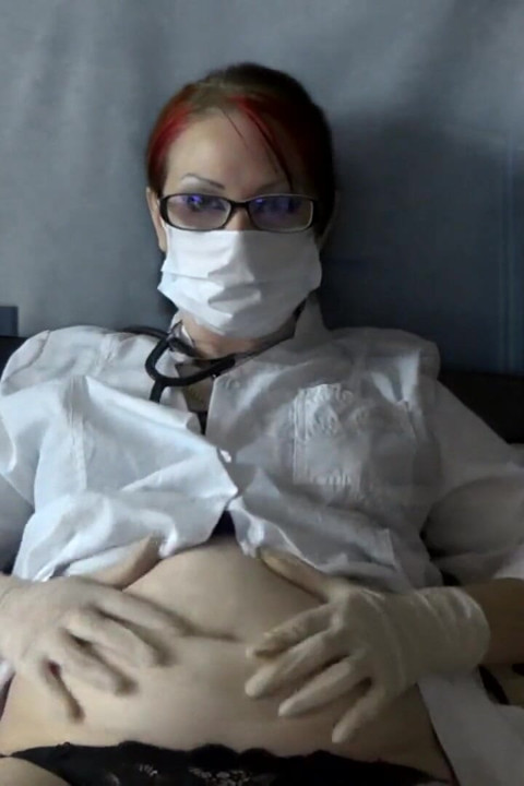 Doctor eating in medical mask and gloves