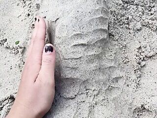 Penis sex art in the summer on a beach