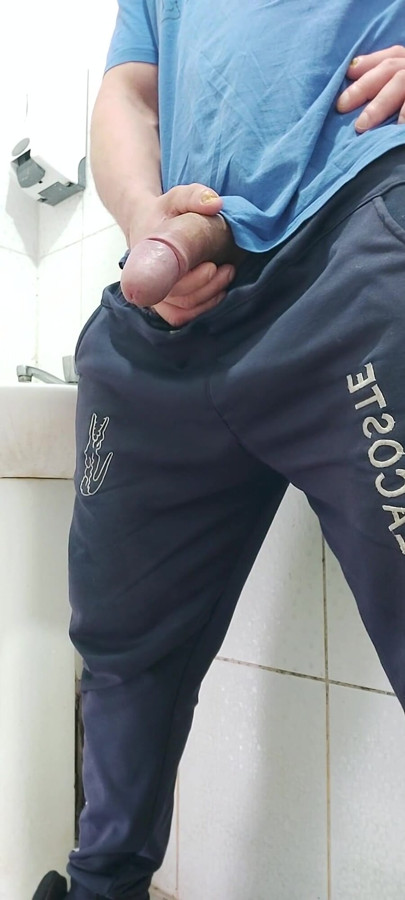 A Well-endowed Brazilian Man Urinating and Showing His Thick Penis to His Female Friends.