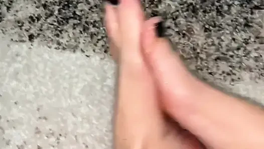 Playing with my feet with a body oil and cream
