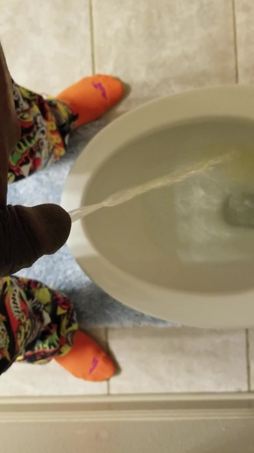 Black guy takes pee