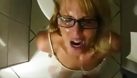 girl with glasses blows and swallows piss from cock