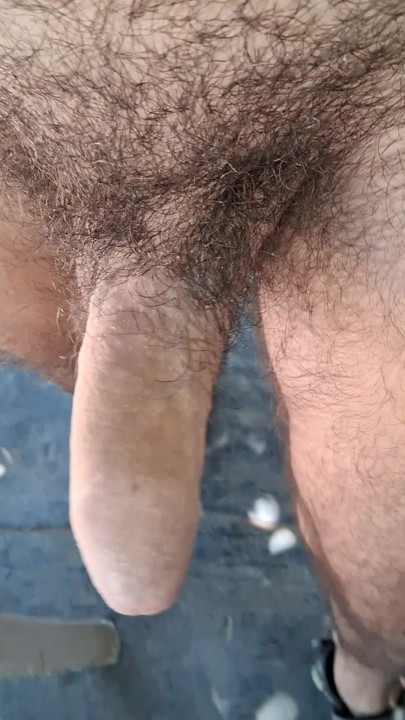 Walking naked with semi-hard cock