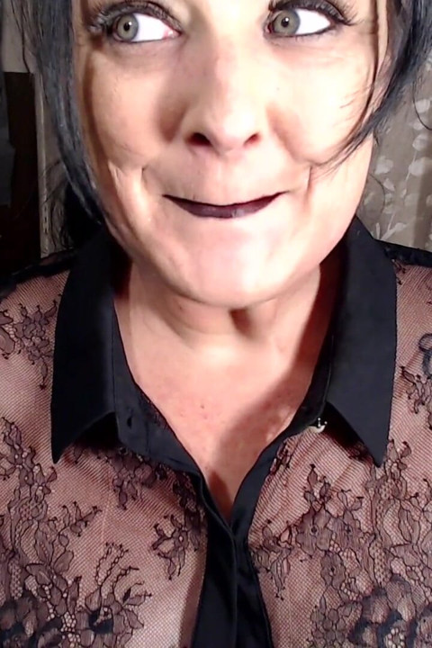 Milf putting on dark red lipstick