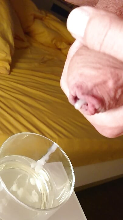 Cumming into a glass of pee