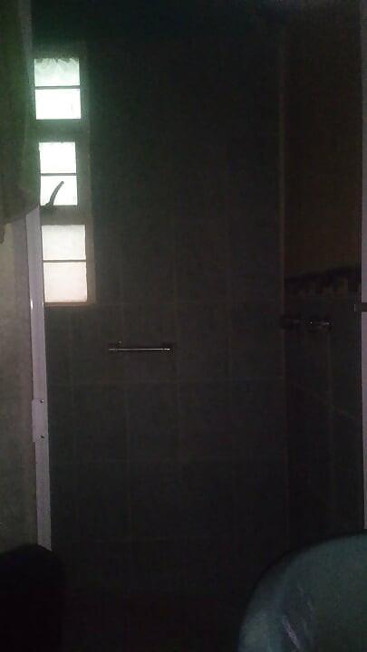 Man Showering with Flashlight On