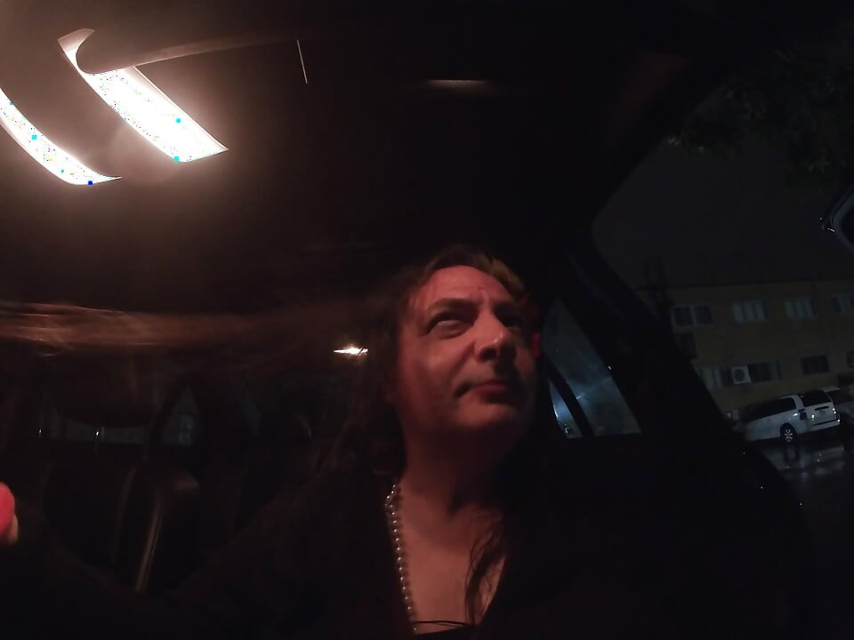Mature sissy CD out in the rain in A parking lot in public masturbation.