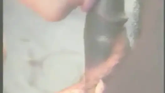 Muscular Stranger in White Superhero Mask Drills Ebony Chick on the Parking of Shopping Mall