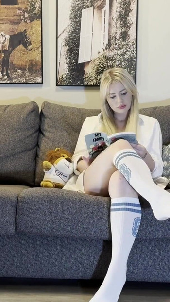 Key moment from "Busty All Natural Big Tits Big Ass Thick Thighs Sexy MILF reads a Book and takes her Panties Off on the Couch"