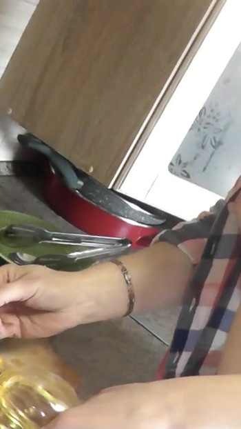 Unforgettable moment from "Milf sexy Platinum continues naked cooking in kitchen preparing salad for Christmas without"
