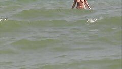 Hot German blonde rubbing her moist pussy on the beach