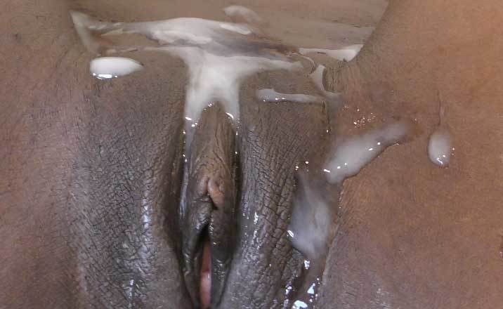 Chocolate pussy covered with thick cum