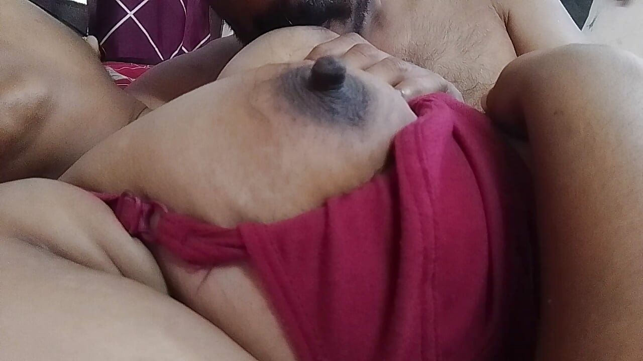 Her husband is sucking the housewife's breasts.