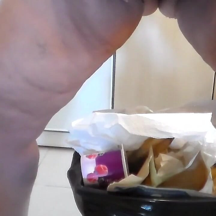 Jen is peeing into the trash can