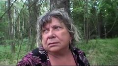 Busty granny having fun in the forest