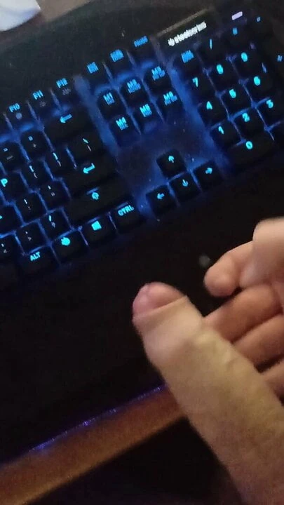 Man solo masturbating to a cumshot on keyboard
