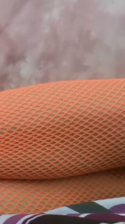 Glass Dildo Solo in an Orange Fishnet Bodysuit - Busty Brunette Plays on the Couch