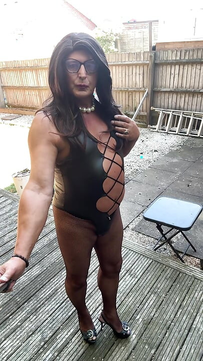 Sexy Crossdresser Kellycd2022's in black pvc bodysuit and fishnet pantyhose