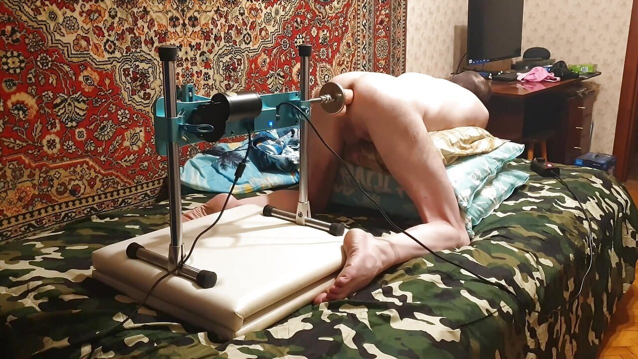 Hot gay having sex with a fuck machine