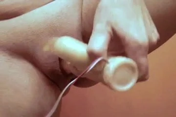 Close-up dildo squirting