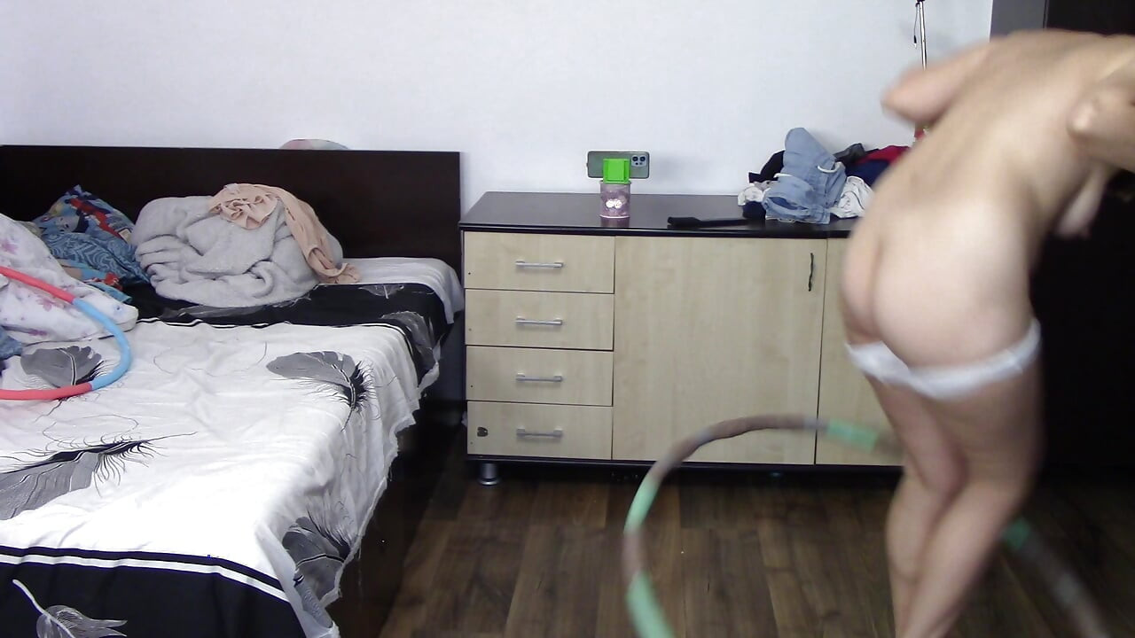 Sexy woman trains naked at home. Sexy brunette tries on pantyhose, hairy pussy, big ass, big tits.