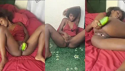 Girl from Mozambique using cucumber for squirting