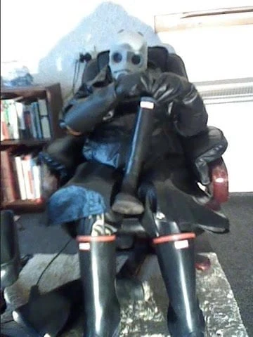 Wanking in rubber.