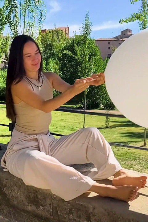 Inflating and Popping Them with Bare Feet Outdoors