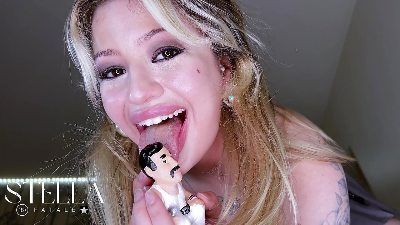 MINIATURE MAN DEVOURED BY GIANT MINIATURE MAN HEAD INSIDE AND CHOKING BY
