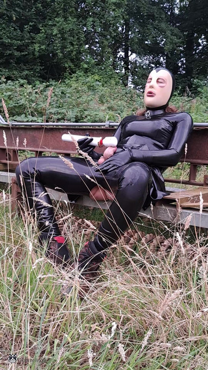 latex sissy cum outside with a vibrator