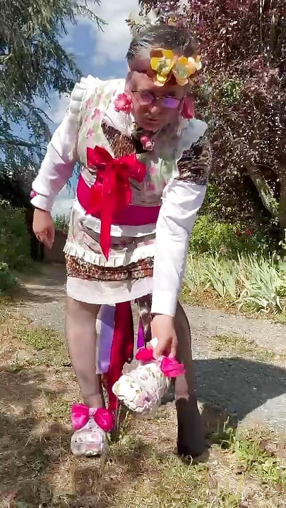 In gardener's clothes with a little leopard dress soaked with pee