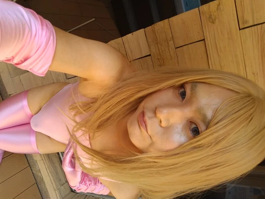 A blonde cross-dresser in a pink costume got and masturbated!