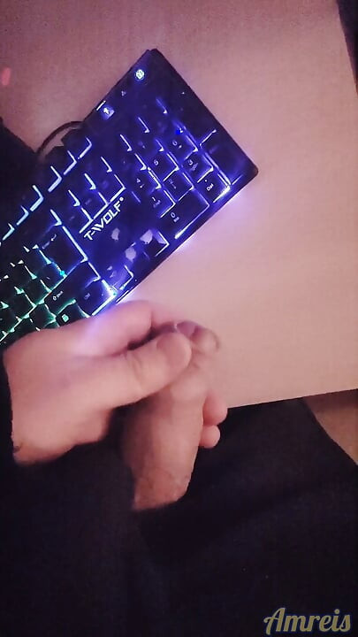 Gamer in the night. Cum on table.