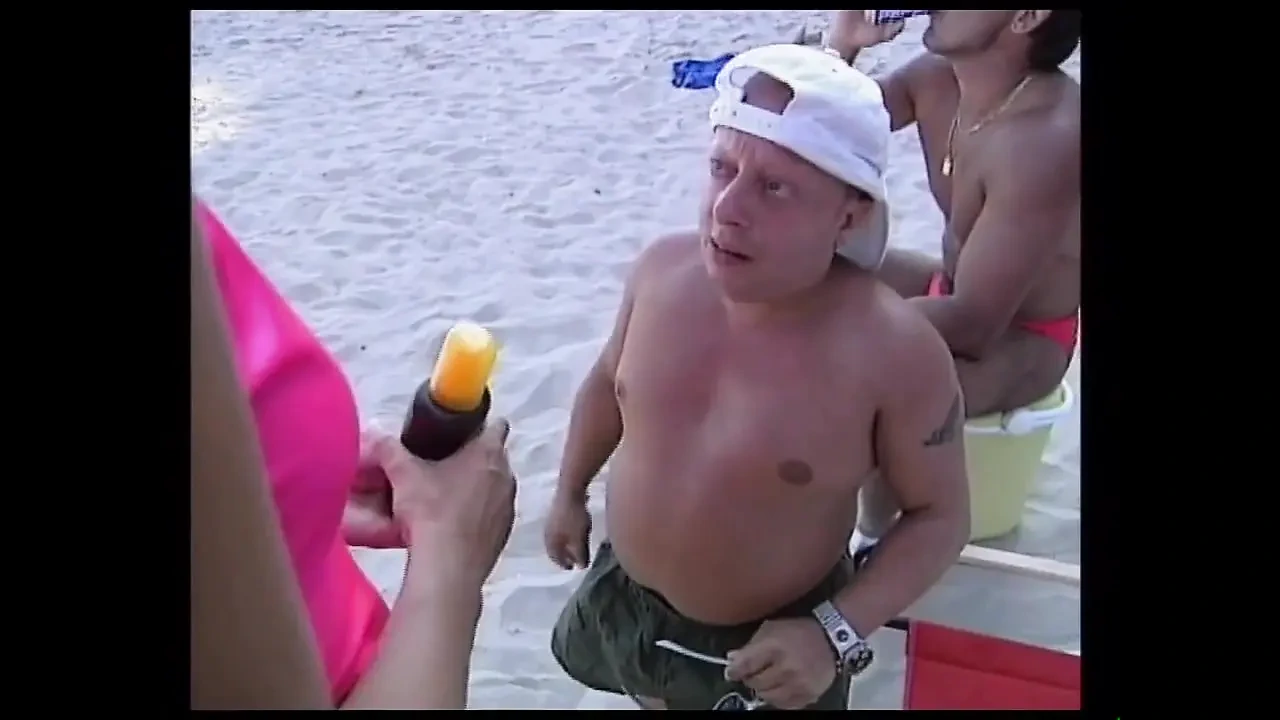 She Give a Nice Suck a Big Cock of His Friend While They Are in the Beach