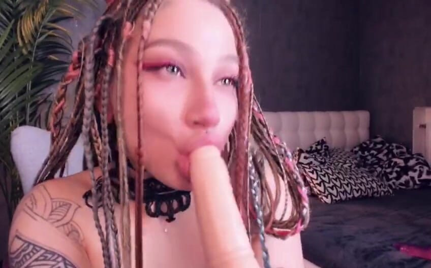 a schoolgirl with a cute face inserted a huge dildo into her narrow mouth