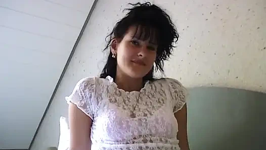 Small titted brunette babe is rubbing her hairy snatch