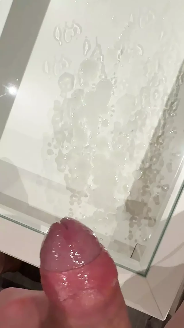 Shooting my huge load over a glass table