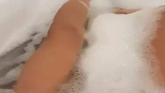 Boy masturbating in bathtub
