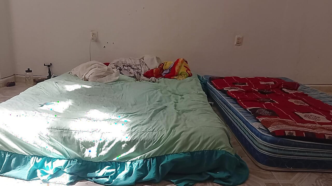 Mexican mother-in-law cleaning guest room in thong