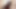 Latex Alice blows and deep throats a dildo while on her knees in the bathroom